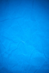 Blue paper crumpled recycle background.