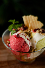 strawberry and pistachio gelato ice cream sundae dessert in bowl