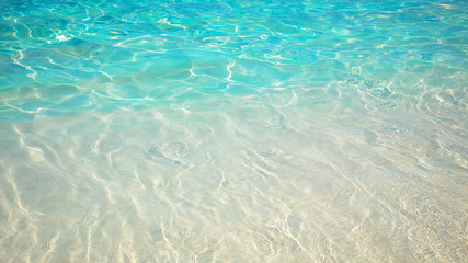 sandy beach and blue sea wave. Beautiful natural background. Tourism and travel.