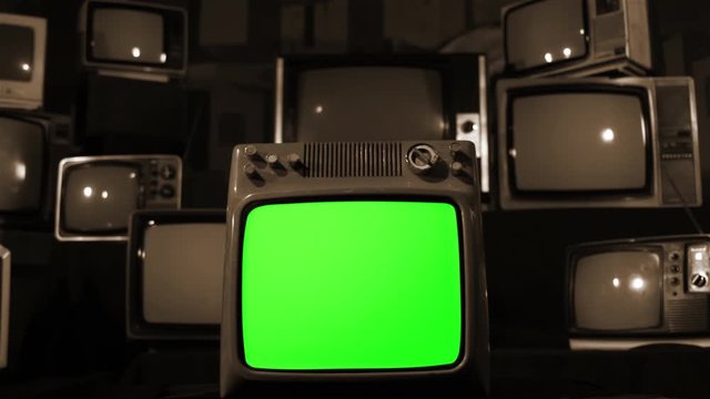 Gun Shooting Into Glass of an Old Retro TV Green Screen. Sepia Tone.