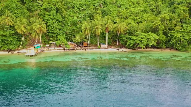 A drone view of a home stay by the beach of Raja Ampat, Papua, Indonesia
