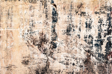 Texture of a concrete wall with cracks and scratches which can be used as a background