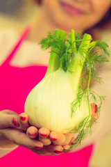 Woman holding fennel bulb