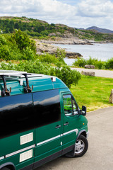 Camper car on coast of Norway with ocean view