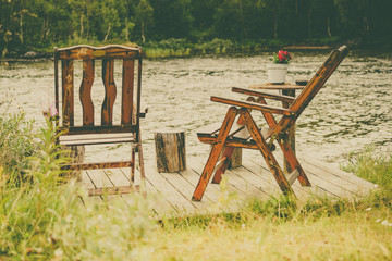 Rest stop area picnic chaires on fjord lake shore