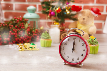 Fototapeta na wymiar Red alarm clock, fingered pointed at twelve or midnight as for countdown for new day celebration and for New Year