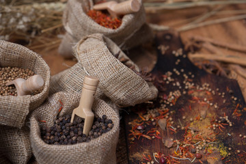 Spicy condiment, herbal aroma dry food for Asian cookin on wood  cutter with dry seed and colorful powder for kitchen ingredient