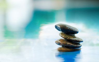 Spa still life with water lily and zen stone in a serenity pool