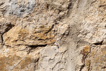 Natural background from a fragment of a stone wall of an old house