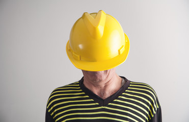 Worker with a yellow helmet.