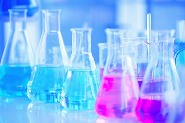 Chemical tube set development and pharmacy in laboratory with green bokeh through windows