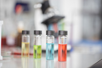 Chemical tube set development and pharmacy in laboratory with green bokeh through windows