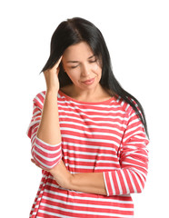 Portrait of beautiful woman suffering from headache on white background