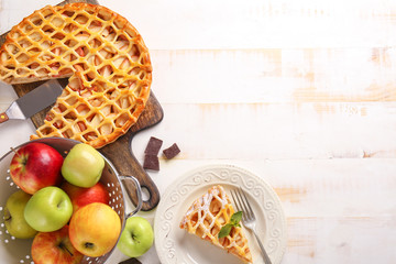 Composition with tasty apple pie on table