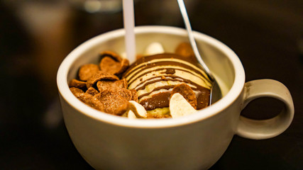 Ice cream is a sweetened frozen food It may be made from dairy milk or cream and is flavored with a sweetener, either sugar or an alternative, and any spice, such as cocoa or vanilla.