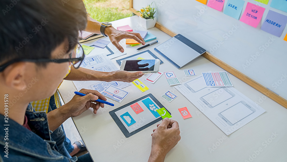 Wall mural creative web designer planning application and developing template layout, framework for mobile phon