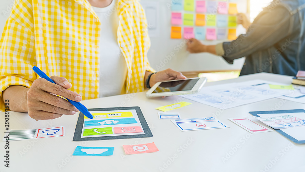 Wall mural creative web designer planning application and developing template layout, framework for mobile phon
