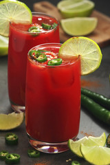 Jalapeno tomato margarita cocktail with lime