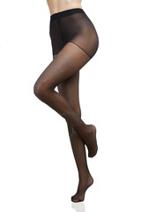 Cropped bottom shot of a female figure in black transparent tights with mermaid tail pattern. The fashion model bent one of her knees.