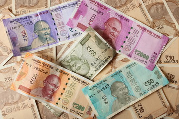 Fototapeta na wymiar Indian currency notes background wallpaper. Money, business, investment, finanance, cash, fund, commerce and economy. 