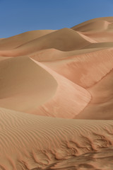 Fototapeta na wymiar into the desert, sand dunes spread as far as the horizon, the arid surrounding is spreading, 