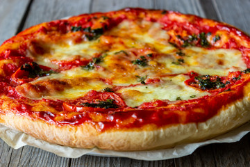 Italian pizza with tomatoes and mozzarella cheese. Italian cuisine. Margherita.