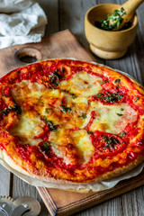 Italian pizza with tomatoes and mozzarella cheese. Italian cuisine. Margherita.