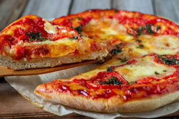 Italian pizza with tomatoes and mozzarella cheese. Italian cuisine. Margherita.