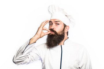 Professional chef man showing sign for delicious. Chef, cook making tasty delicious gesture by kissing fingers. Cook hat. Bearded chef, cooks or baker. Bearded male chefs isolated on white, perfect