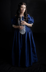 Renaissance woman in blue silk dress