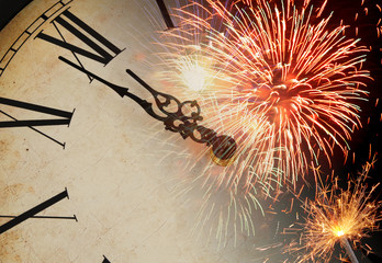 Celebration new year concept. Old clock with fireworks. 