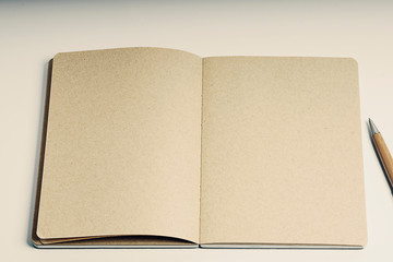 Open craft notepan on white background 