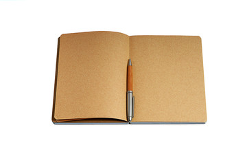 Open craft notepad with a pen isolated on white backgroung