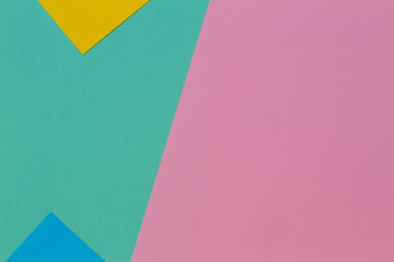 Abstract geometric paper texture background with trendy colors pastel pink, yellow, light blue and green color