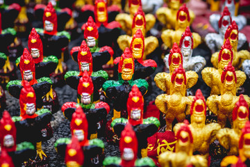 chinese lanterns at the bazaar,Many Gamecock statues,Chicken background