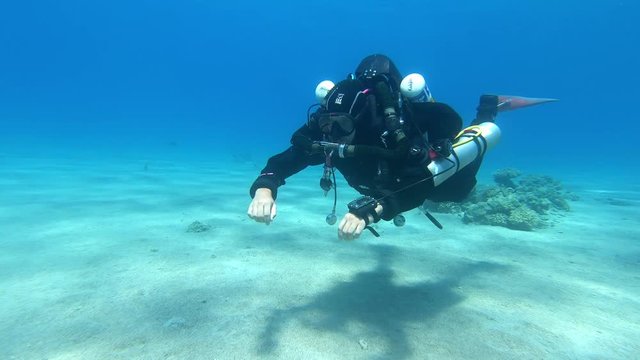 Rebreather SCUBA diver exploring red sea