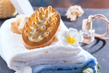 Zero waste concept. Eco-friendly bath set with brushes and towel, aroma in glass bottle , bast and...
