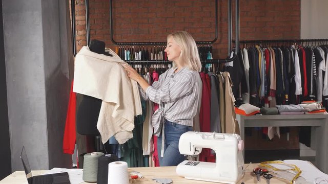 Young dressmaker creating a garment. Job, professiona, occupation