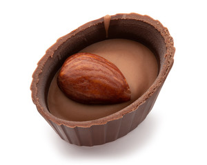 Small chocolate basket with cream and nut on a white background