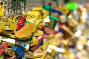 Fototapeta na wymiar Locks symbol of love at the bridge