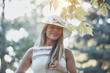 Young woman enjoying in autumn colored nature.