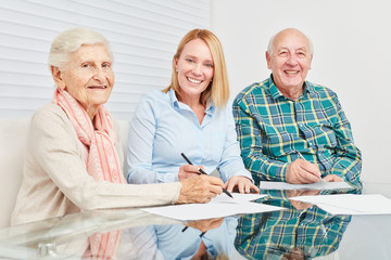 Senior couple with contract by consultant