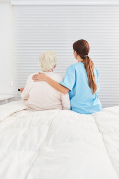 Caregiver cares about old senior citizen