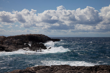 rough seas on the reef in a cloudy day.