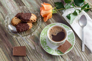 The brewed coffee, biscuits and chocolate