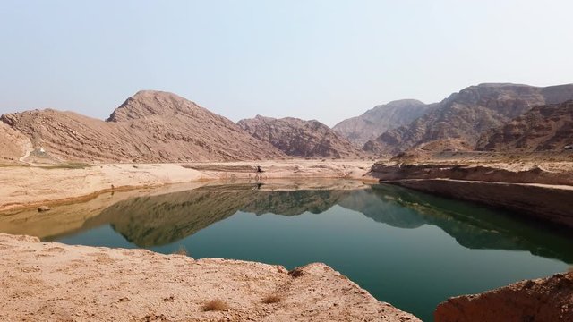 Water reservoir lake in the desert at Jebel Jais mountain in Ras al khaimah emirate of the UAE