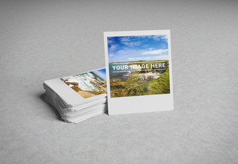 Fototapeta na wymiar Stack of instant photos on concrete surface 3D rendering