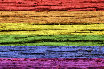 LGBT flag on an old wooden surface.