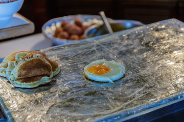 Breakfast with coffee surrounded by various food