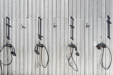 Shower on the wall at the beach in autumn